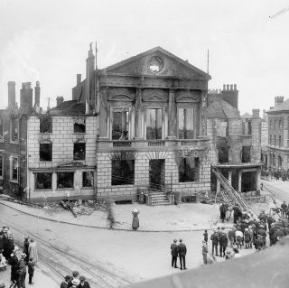 A photograph of Luton Town Hall after the Peace Day riots.